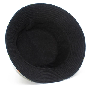 Close-up of black cotton bucket hat interior showing clean stitching and colorful prints
