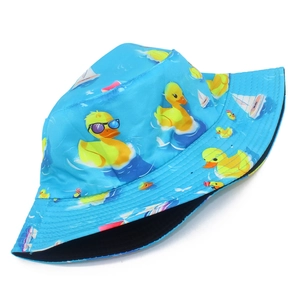 Detail of blue outdoor bucket hat with yellow duck and white sailboat cartoon print