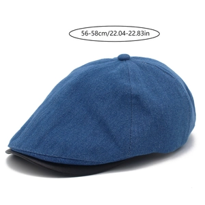 Detail view of denim flat cap with leather brim featuring 56-58cm head circumference size