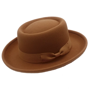 Classic dark brown wool pork pie hat with elegant grosgrain ribbon and bow decoration