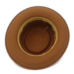 Detail of brown felt fedora hat interior with yellow sweatband and adjustable drawstring