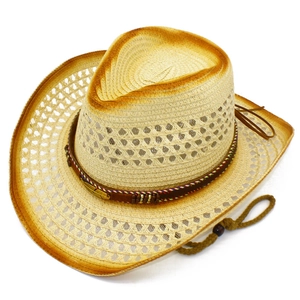 Detailed close-up of hollow-weave western straw hat with brown leather band and beads