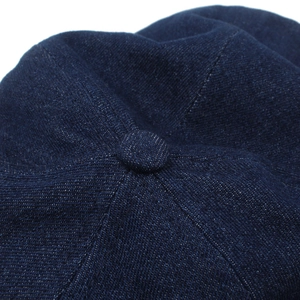 Detailed macro view of the dark blue denim hat crown with reinforced stitching
