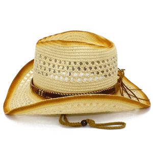 Detail of woven straw cowboy hat with gradient burnt edges and ethnic patterned band