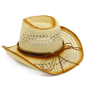 Detailed macro view of woven cowboy hat with diamond hollow vents and ethnic trim