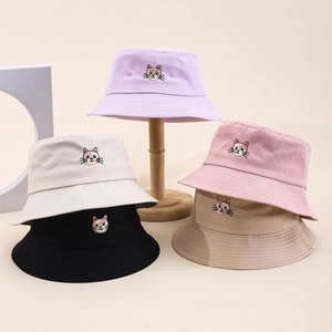 Detailed embroidery of cat heads on cotton bucket hats in five assorted colors