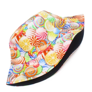 Close-up of candy pattern bucket hat with colorful lollipops and black fabric lining