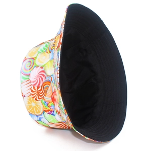 Detailed view of colorful candy and fruit print pattern on a stylish sun bucket hat