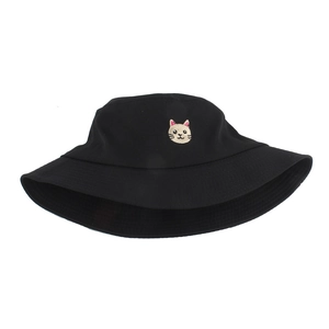 Close-up of a black bucket hat featuring a detailed cat face embroidery on the front