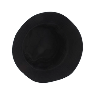 Interior view of black bucket hat with wide brim showing durable fabric texture