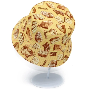 Double-sided bucket hat with yellow cheese and stripe pattern for outdoor sun protection