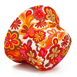 Retro floral print cotton bucket hat with vibrant 70s style flowers on white background
