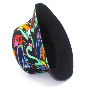 Detail of street-style bucket hat featuring vibrant graffiti print on black canvas fabric