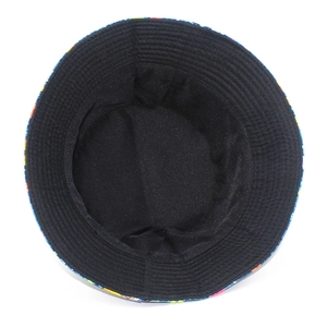 Detail view of the black inner lining and colorful graffiti print on the bucket hat brim