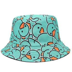Close-up of mint green bucket hat featuring repeating cartoon duck patterns and fabric texture