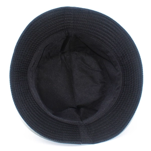 Detail of multi-row reinforced stitching and fabric texture on a black cotton bucket hat