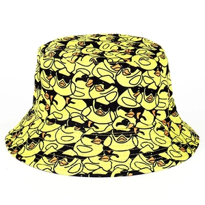 Detail of trendy bucket hat with all-over cartoon duck print in vibrant yellow color