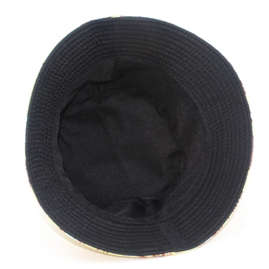 Detail of reinforced stitching and black inner lining on a reversible pattern bucket hat