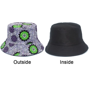 Reversible bucket hat detail showing colorful floral pattern and solid black cotton side