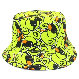 Neon yellow reversible bucket hat with all-over cartoon duck print for sun protection