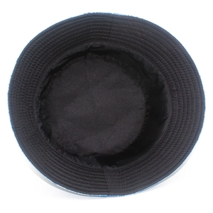 Top view of reversible bucket hat showing blue denim fabric and black inner lining stitches