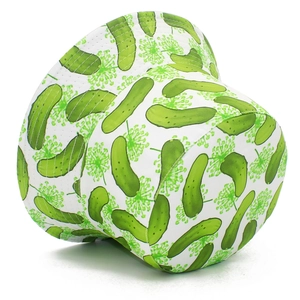 Detail shot of a double-sided bucket hat featuring a trendy green cucumber print on white fabric