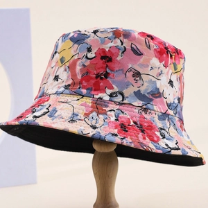 Floral bucket hat for outdoor sun protection featuring red and yellow flower patterns
