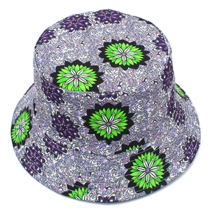 Detailed top view of a bucket hat featuring bold green flowers and purple floral prints