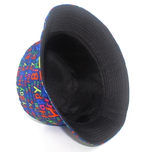 Detailed close-up of dark blue bucket hat with colorful Happy Birthday print and stitching