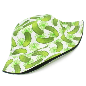 Detailed view of white bucket hat with green pickle patterns and neat stitching