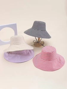 Detail view of wide brim striped sun hats with windproof ropes in multiple colors