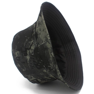 Detailed view of camouflage bucket hat with dark green patterns and black lining