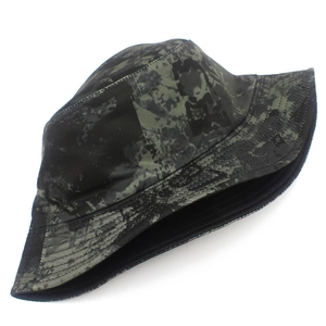 Detailed view of dark green camouflage bucket hat with reinforced brim stitching and black lining
