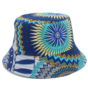 Detail of ethnic geometric sun patterns on the blue and orange printed bucket hat