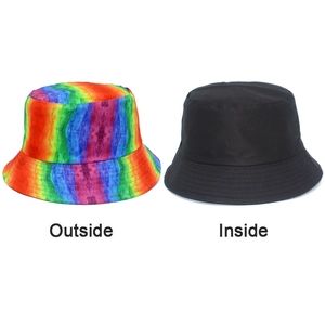Detail of reversible bucket hat showing rainbow tie-dye exterior and black interior