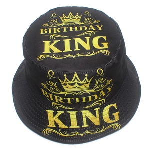 Black canvas bucket hat featuring a gold Birthday King crown print with sun protection