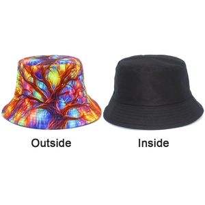 Dual-sided bucket hat featuring abstract colorful tree prints and solid black inner lining