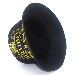 Detailed view of black cotton bucket hat featuring gold crown and Birthday embroidery