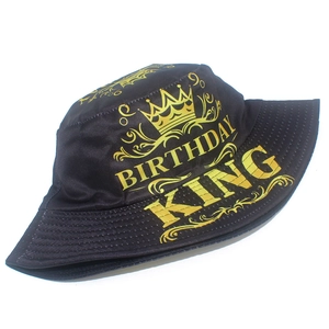 Detail view of a black bucket hat with gold Birthday King text and crown embroidery