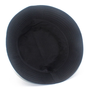 Detail showing the internal crown structure and parallel stitched brim of a black bucket hat