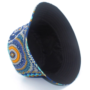 Close-up of ethnic bucket hat with geometric tribal pattern and black lining detail