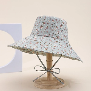 Classic floral bucket hat with pink and white flower patterns and a windproof chin strap