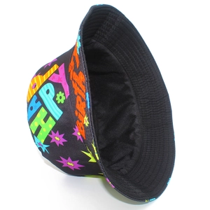 Detail view of colorful Happy Birthday graffiti print and clean stitching on a black bucket hat
