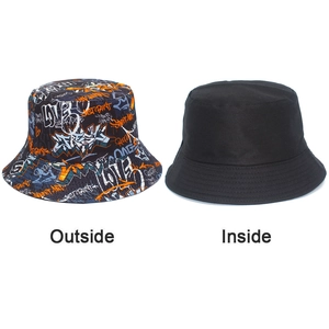 Dual-sided bucket hat showing vibrant street graffiti print and a plain black minimalist side