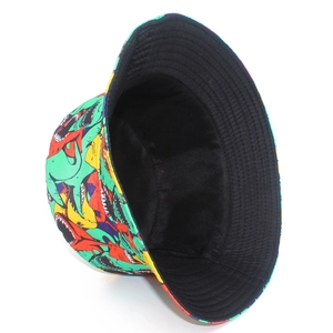 Detail view of colorful shark pattern bucket hat showing reinforced stitching and black lining