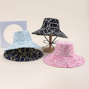 Close-up of four leopard print wide brim sun hats in various colors with windproof ropes
