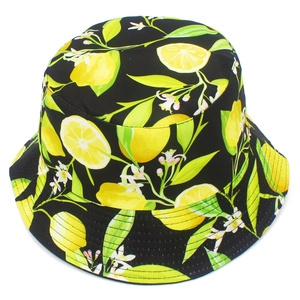 Top view of bucket hat with all-over lemon print and white flowers on black background