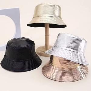 Detail of metallic bucket hats in gold, silver and bronze with fine satin texture