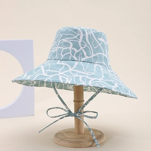 Classic light blue leopard pattern sun hat with white abstract lines and chin tie strap
