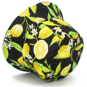 Detail of a black bucket hat with lemon print, floral pattern, and reinforced brim